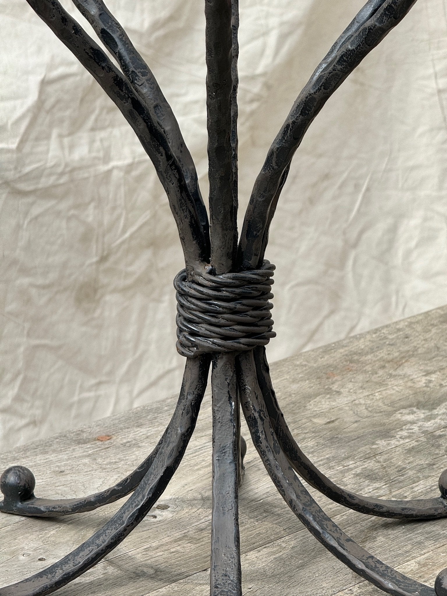 Vintage six-arm scrolled candelabrum crafted from cast iron, showcasing French-inspired elegance and antique patina, ideal for refined home interiors — Hommes and Gardens, Candles Collection, Candle Holders, Decorative Objects, Vintage Iron Decor, Antique Lighting, Rustic French Design, Classic Table Centerpiece.