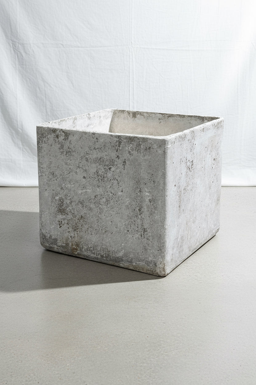Willy Guhl cube planter from 1960s Switzerland featuring a weathered concrete patina and stamped design, a rare mid-century modern collectible for indoor or outdoor decor — Hommes and Gardens, Pots and Vessels Collection, Planters, Garden Decor, Swiss Design, Vintage Concrete, Mid Century Modern, Designer Planter, Architectural Accent, Collectible Home Styling.