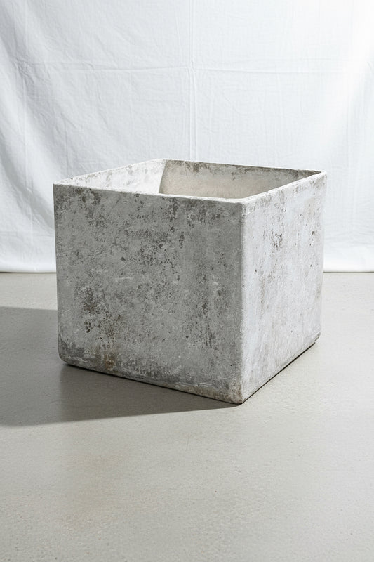 Willy Guhl cube planter from 1960s Switzerland featuring a weathered concrete patina and stamped design, a rare mid-century modern collectible for indoor or outdoor decor — Hommes and Gardens, Pots and Vessels Collection, Planters, Garden Decor, Swiss Design, Vintage Concrete, Mid Century Modern, Designer Planter, Architectural Accent, Collectible Home Styling.