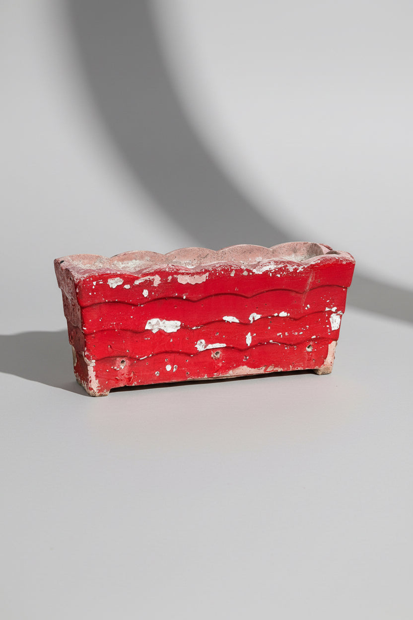 Willy Guhl vintage red planter from 1960s Switzerland, crafted in concrete with aged patina and bold mid-century modern design — Hommes and Gardens, Pots and Vessels Collection, Planters, Designer Decor, Mid Century Style, Vintage Concrete Planter, Swiss Design, Outdoor Living, Collectible Home Accent, Architectural Garden Decor.