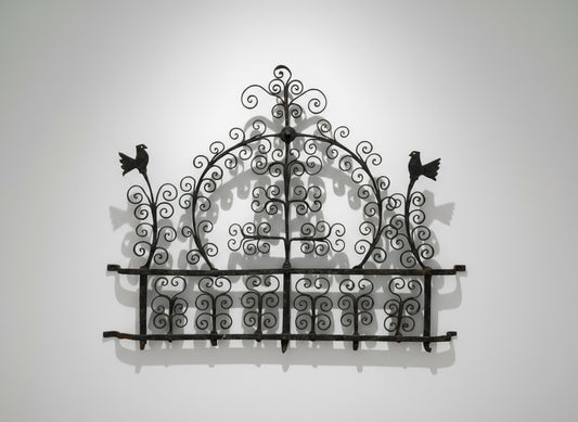Antique 17th-century Spanish-style wrought iron wall rack with decorative bird motifs and scrollwork — Hommes and Gardens, Home Decor Collection, Wallscape, landscape design, plant design, Landscape Architect, Interior Designer, Outdoor Living, Outdoor Decorations, Home Design, Luxury Design, Art, Furniture, Objects, Best Gifts, Nature, Backyard, Yard.