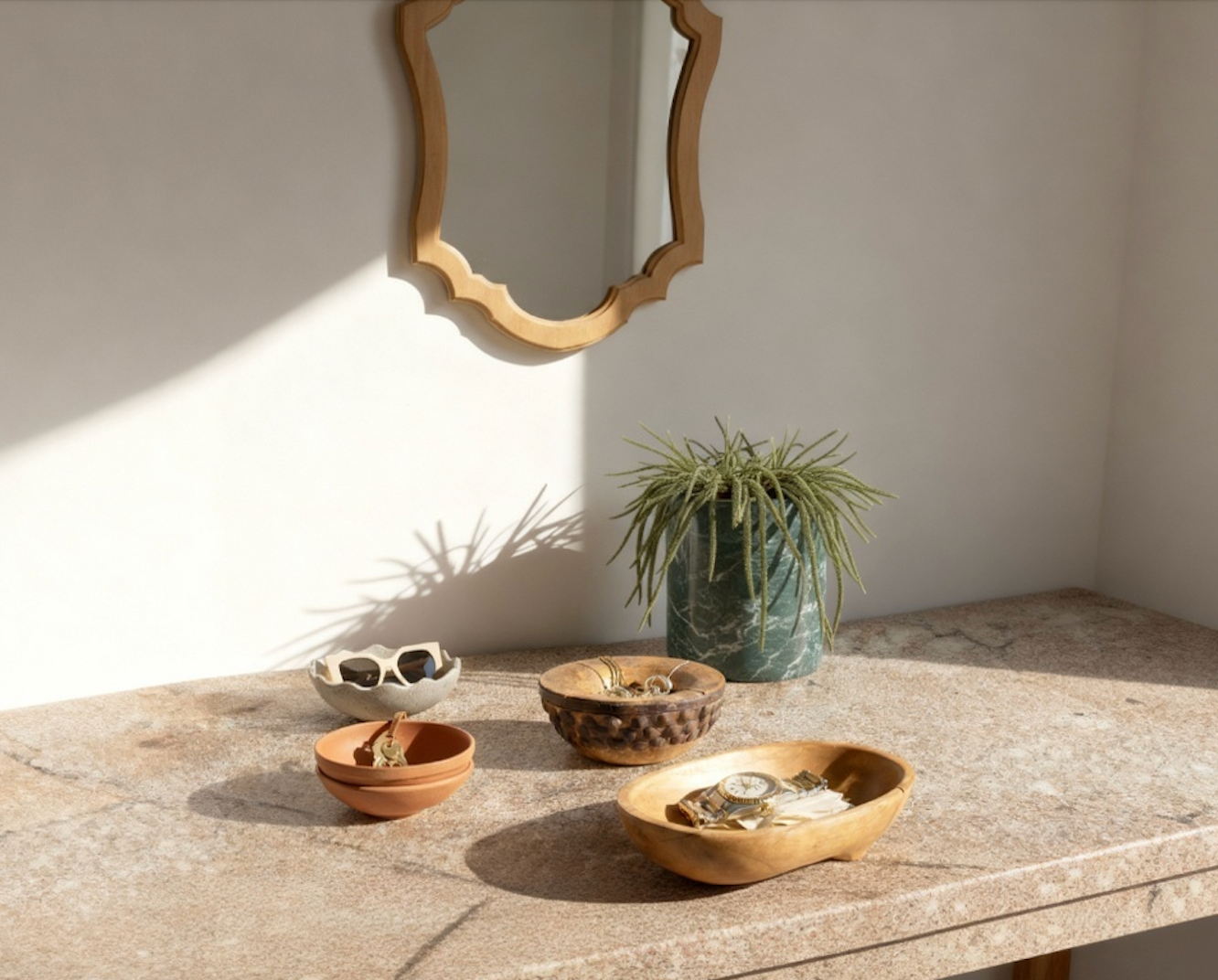A stylish decorative catchall tray collection displayed on a serene surface, ideal for organizing everyday items.