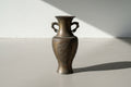 Antique Asian Bronze Vase with Sculptural Handles and Floral Relief Panels