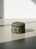 Hand-Carved Dark Grey Terracotta Lidded Vessel with Tribal Portrait Reliefs & Horse Motif