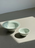 Elegant handcrafted celadon glazed ceramic bowl set by Paula, signed and dated 2003, featuring one large and one small bowls in soft green tones — Hommes and Gardens, Catchall Collection, Landscape Architect, Interior Designer, Outdoor Living, Art, Furniture, Objects, Best Gifts, Nature, Backyard, Yard, Outdoor Decorations, Home Decor, Home Design, Luxury Design.