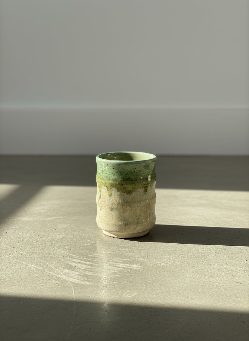 hand thrown studio pottery tumbler with green drip glaze