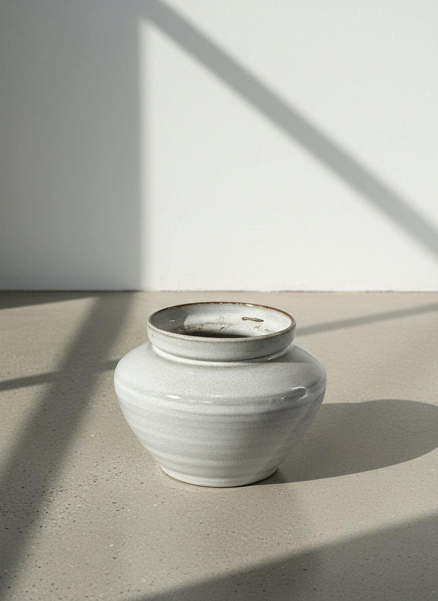 Elegant Handcrafted White Stoneware Vessel with Warm Rustic Rim Accents