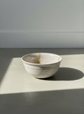 handcrafted speckled stoneware bowl with drip glaze detail
