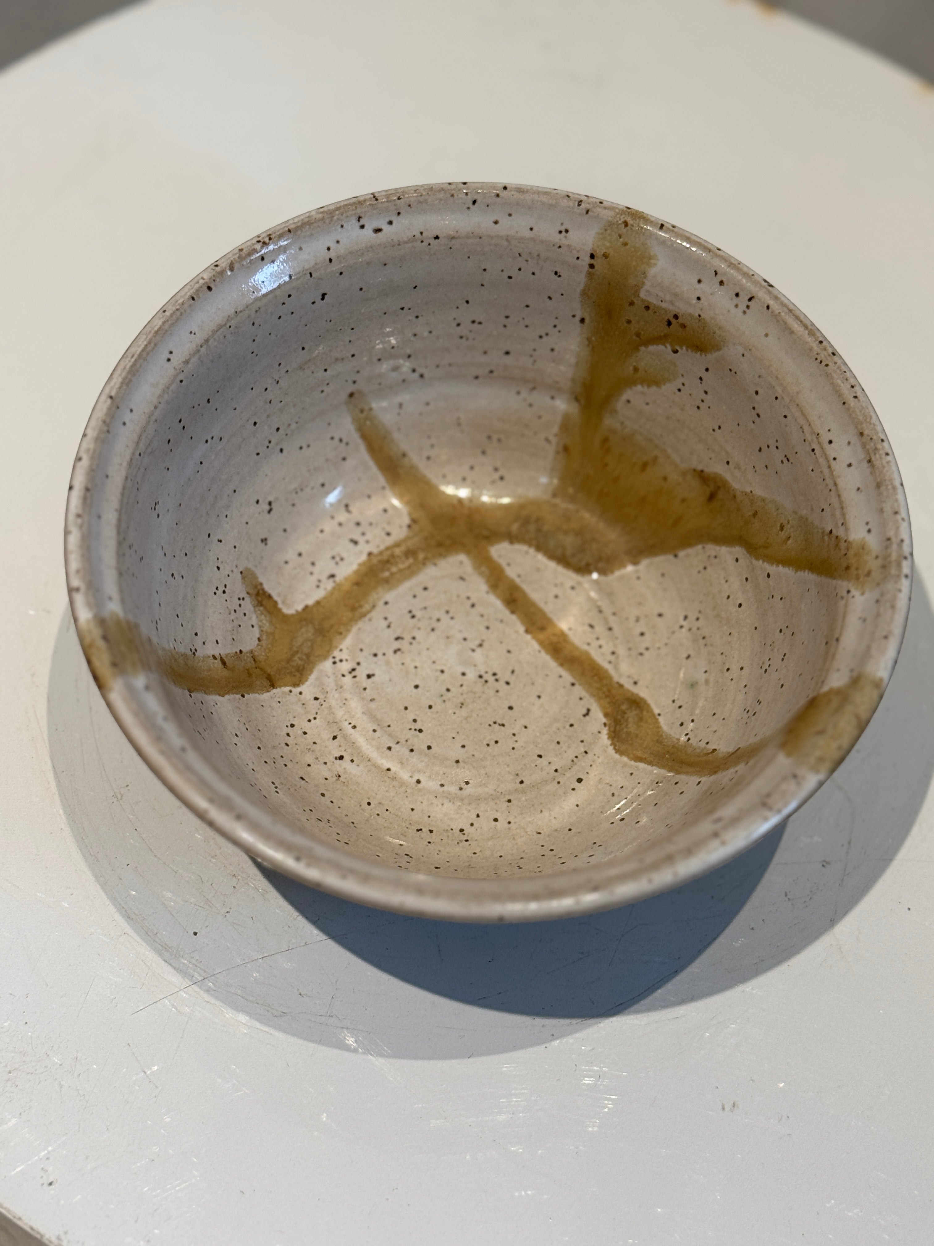 Handcrafted Speckled Stoneware Bowl with Warm Drip Glaze Detailing – Signed Studio Pottery