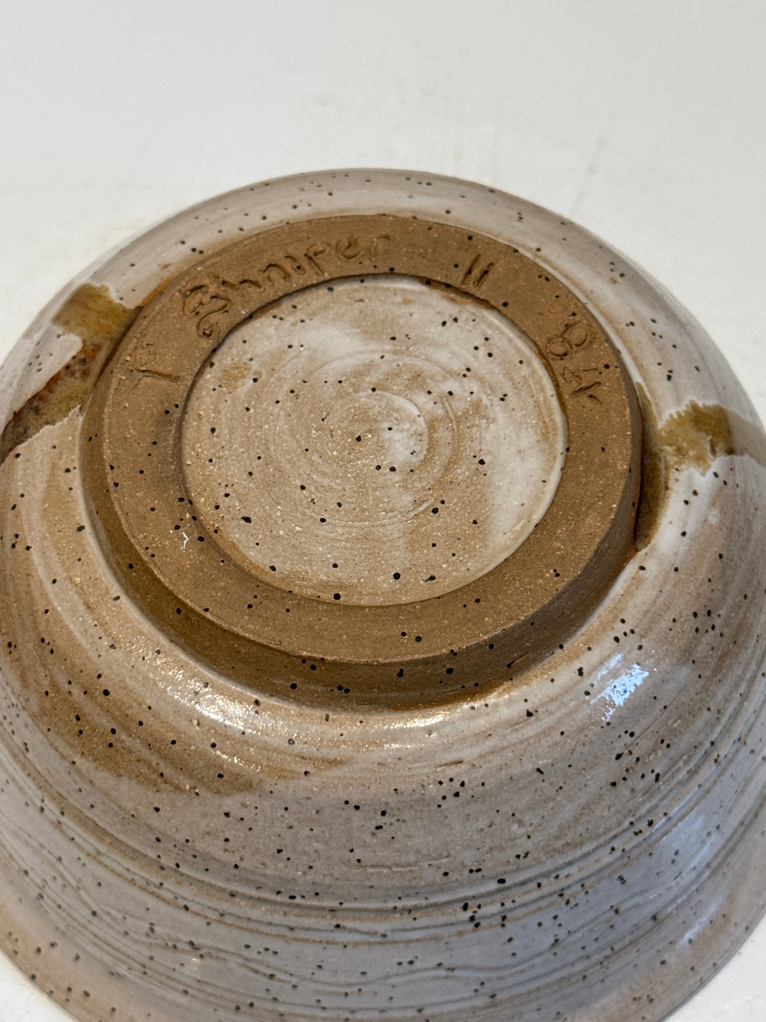 Handcrafted Speckled Stoneware Bowl with Warm Drip Glaze Detailing – Signed Studio Pottery