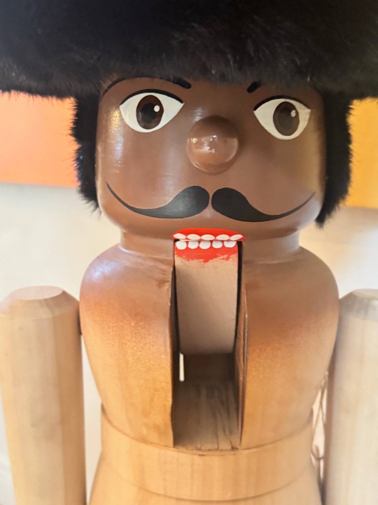 Hand-Carved Wooden Nutcracker Figure with Fur Hat, Sculptural Folk Art Form, Late 20th Century