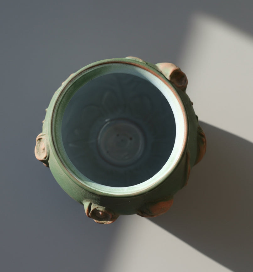 Top view of a Mid-Century Portuguese Art Pottery Vase with Raised Tulip Relief in Matte Green & Terracotta, hommes + gardens estudio.