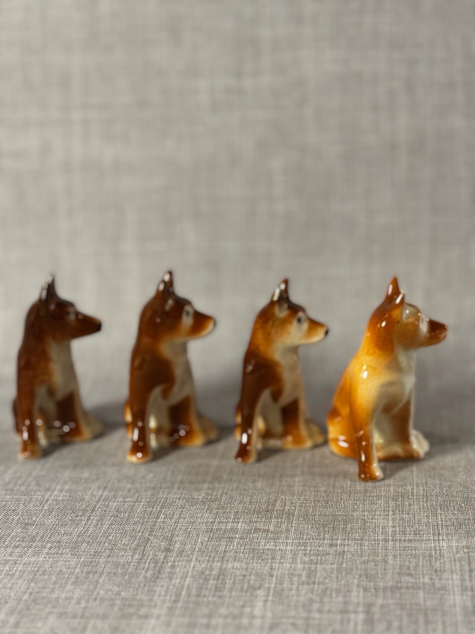 Set of 4 Vintage Hand-Painted Ceramic Sitting Dogs – Brown & Cream Glazed Figurine Pack
