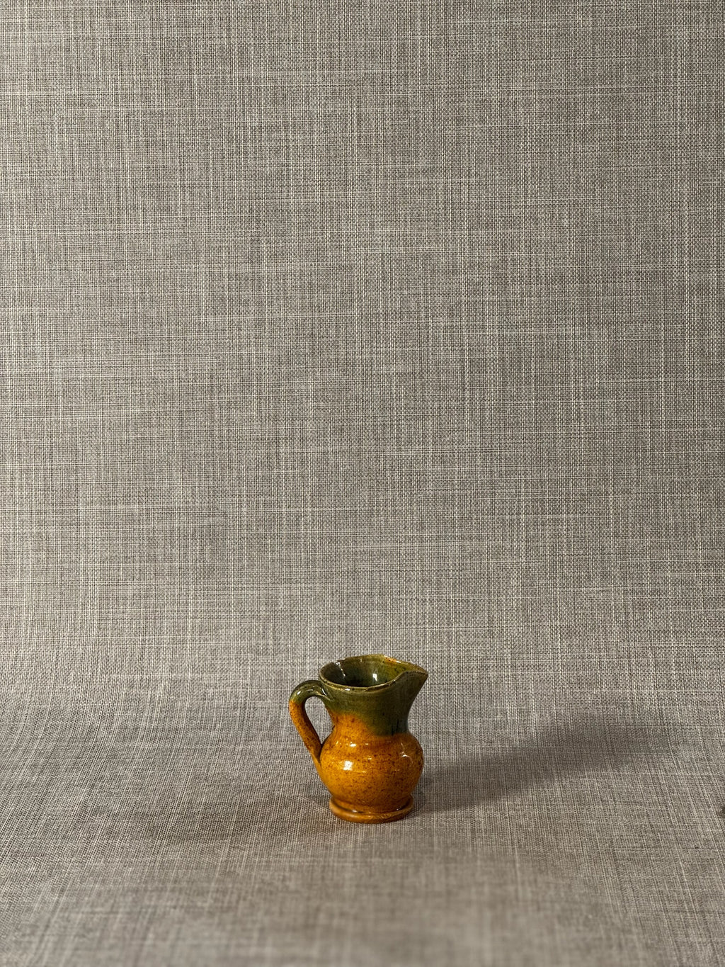 small handmade ceramic pitcher