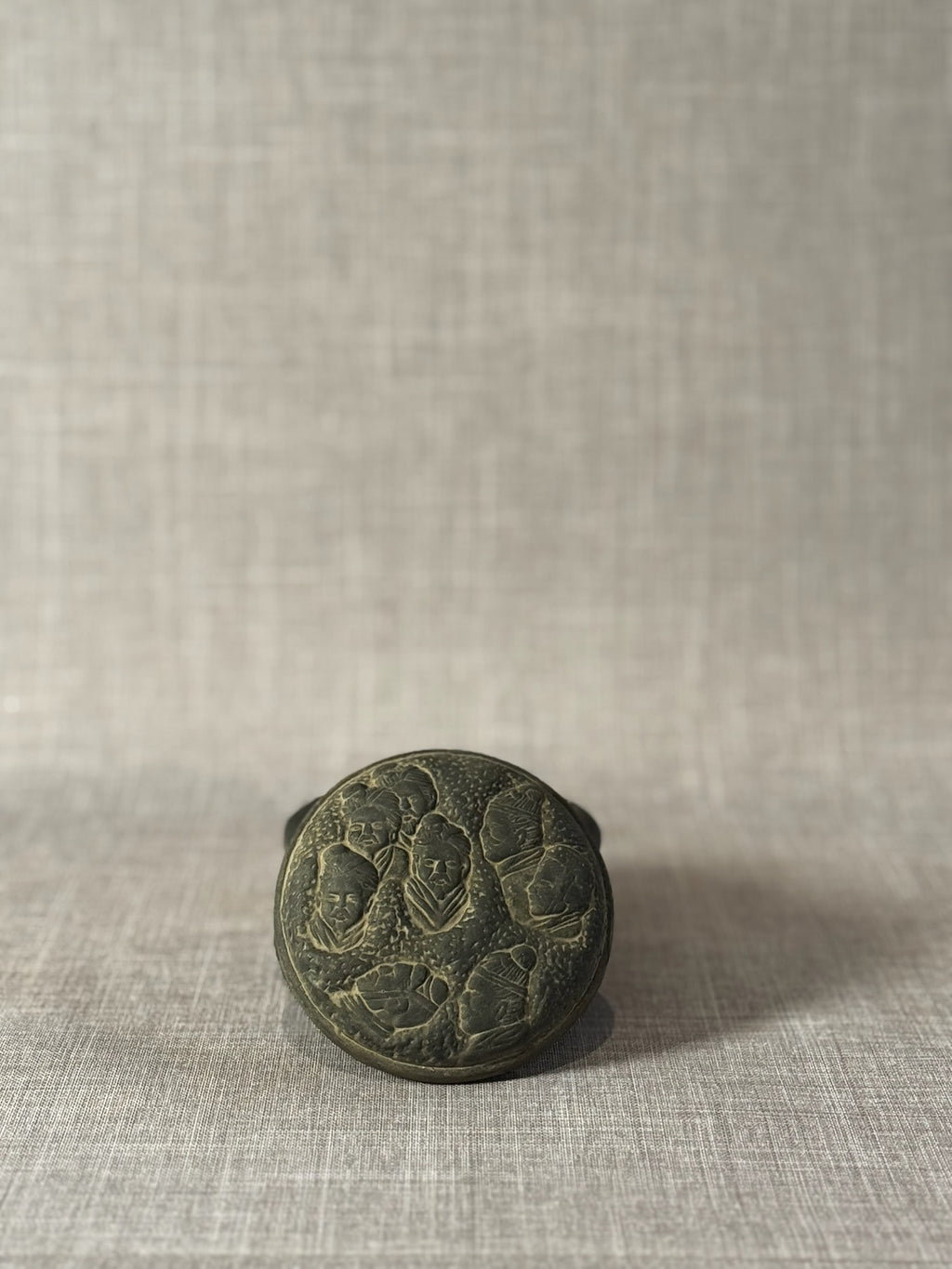 Hand-Carved Dark Grey Terracotta Lidded Vessel with Tribal Portrait Reliefs & Horse Motif