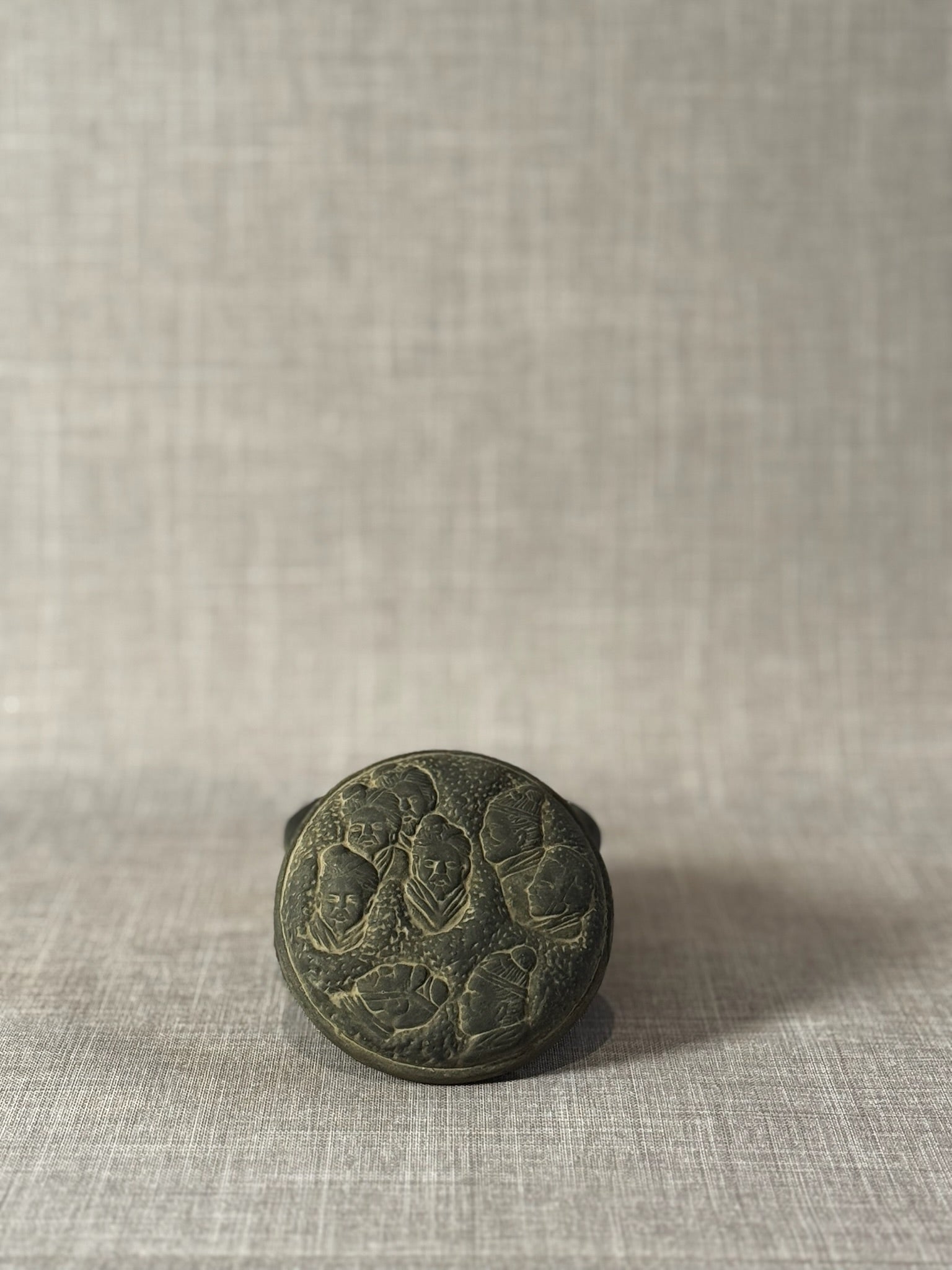 Hand-Carved Dark Grey Terracotta Lidded Vessel with Tribal Portrait Reliefs & Horse Motif