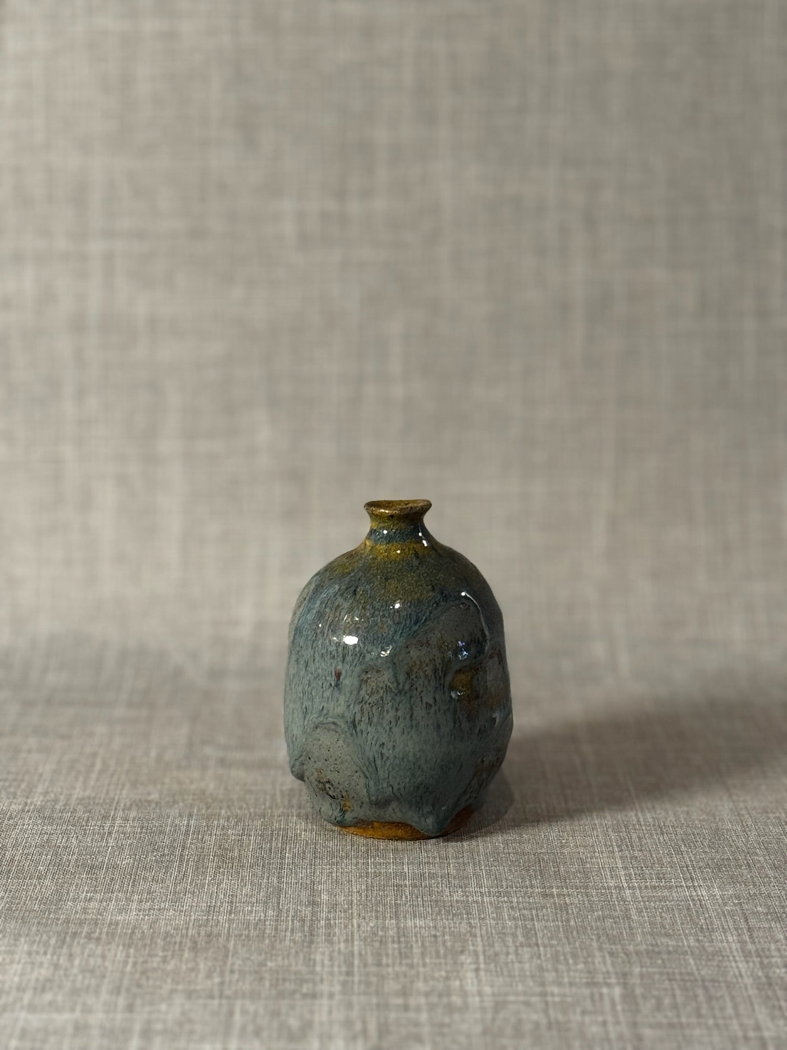 Handmade Studio Pottery Bud Vase with Flowing Blue-Green Lava Glaze & Ochre Accents