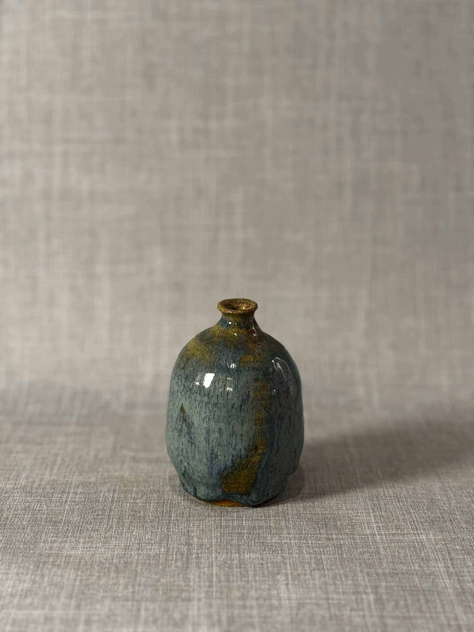 Handmade Studio Pottery Bud Vase with Flowing Blue-Green Lava Glaze & Ochre Accents