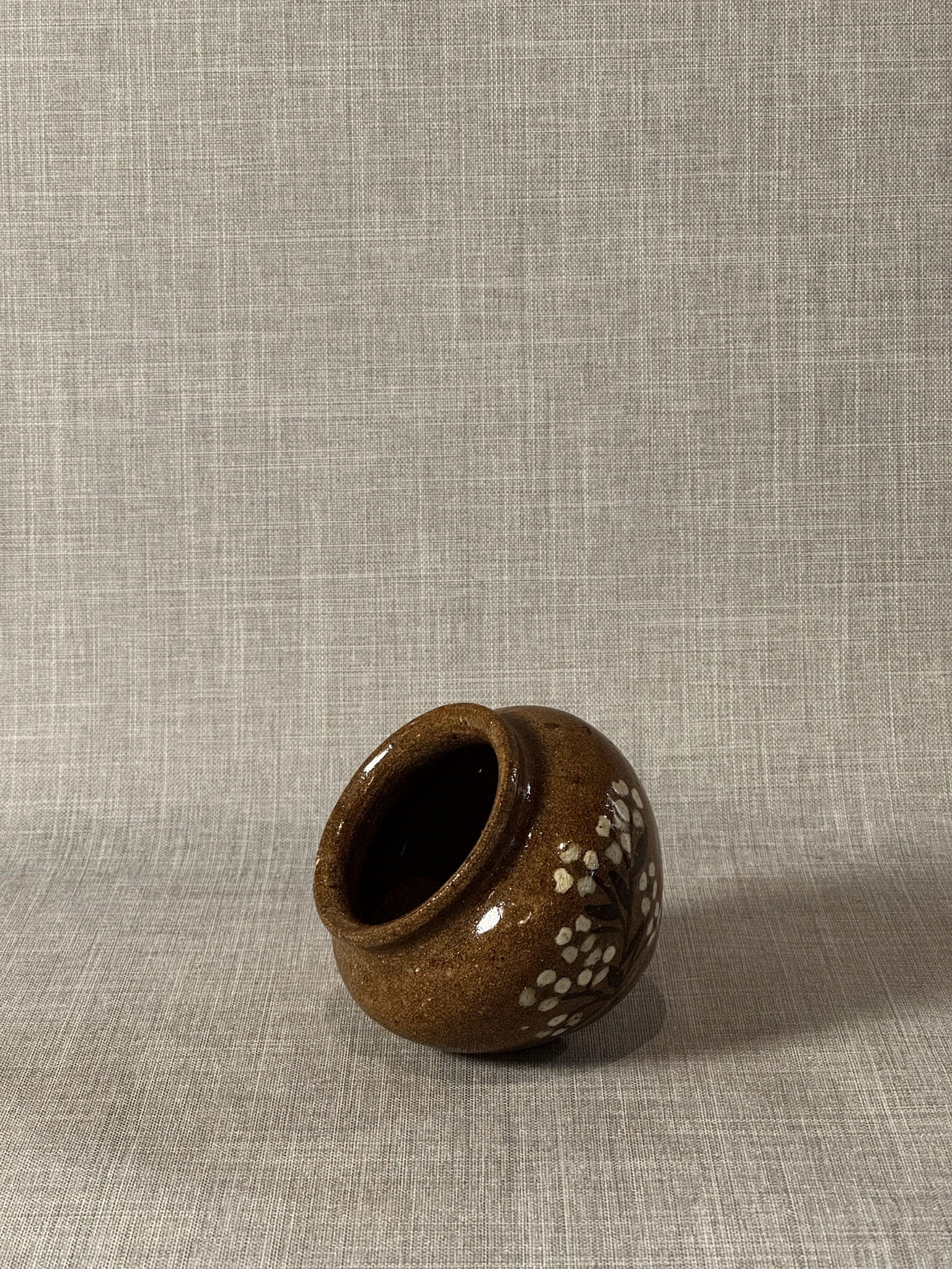 Rustic Handcrafted Brown Glazed Stoneware Jar with White Floral Brushwork