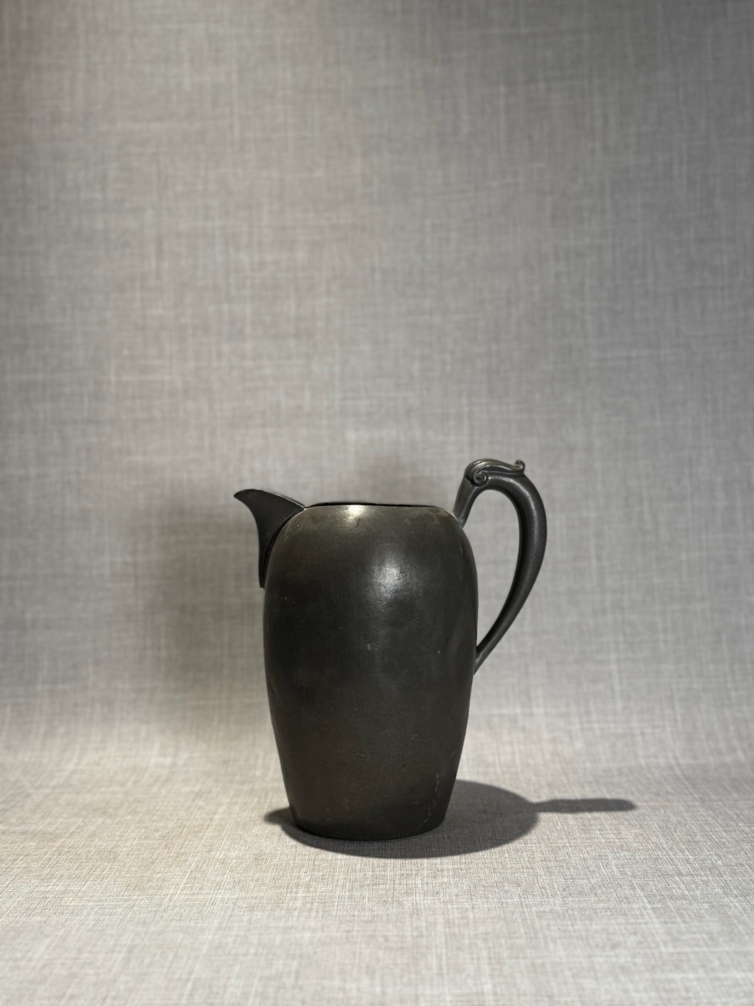 Vintage Black Ceramic Pitcher with Sculpted Scroll Handle – Matte Handcrafted Art Pottery Vessel