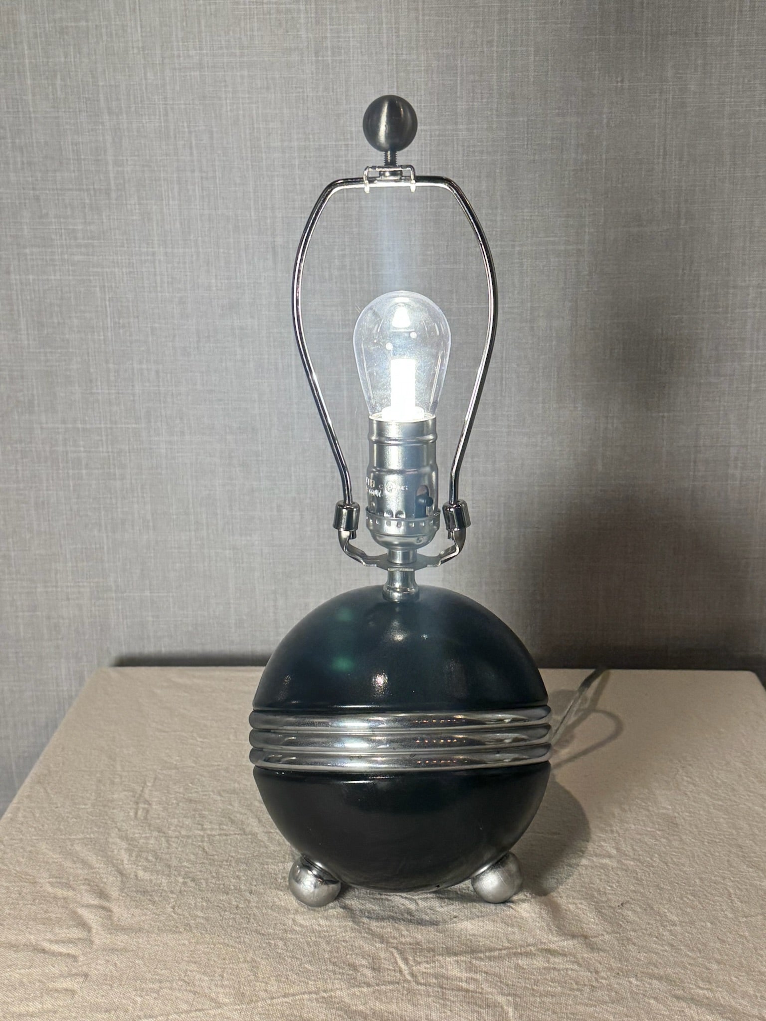 Art Deco Style Black Ceramic Orb Table Lamp with Chrome Banding and Tripod Feet