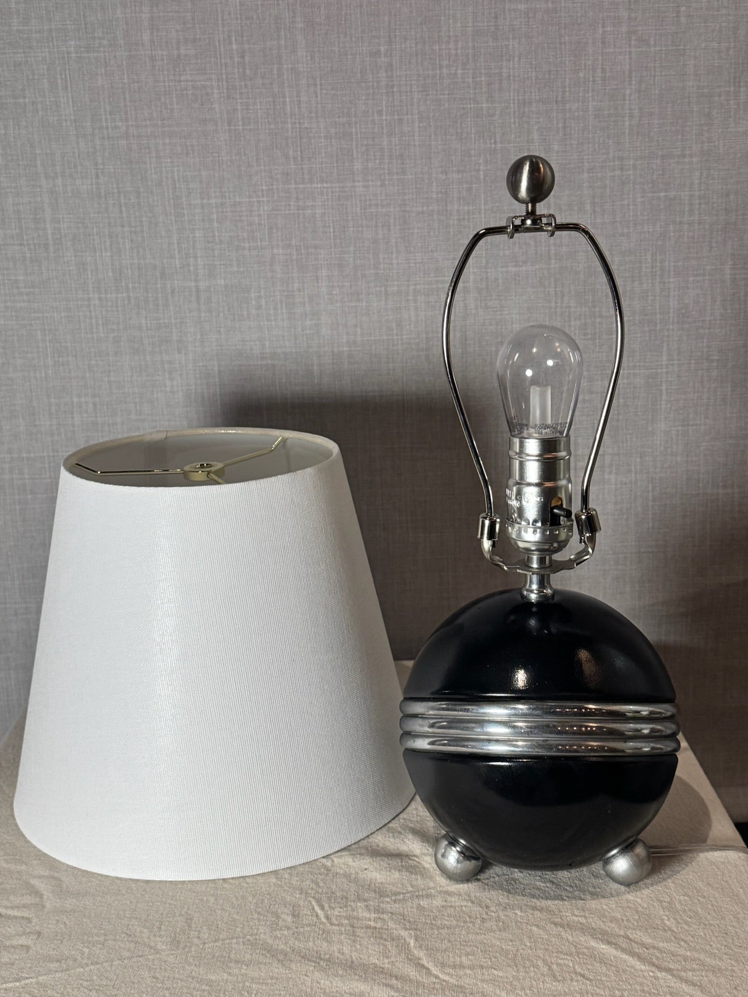 Art Deco Style Black Ceramic Orb Table Lamp with Chrome Banding and Tripod Feet