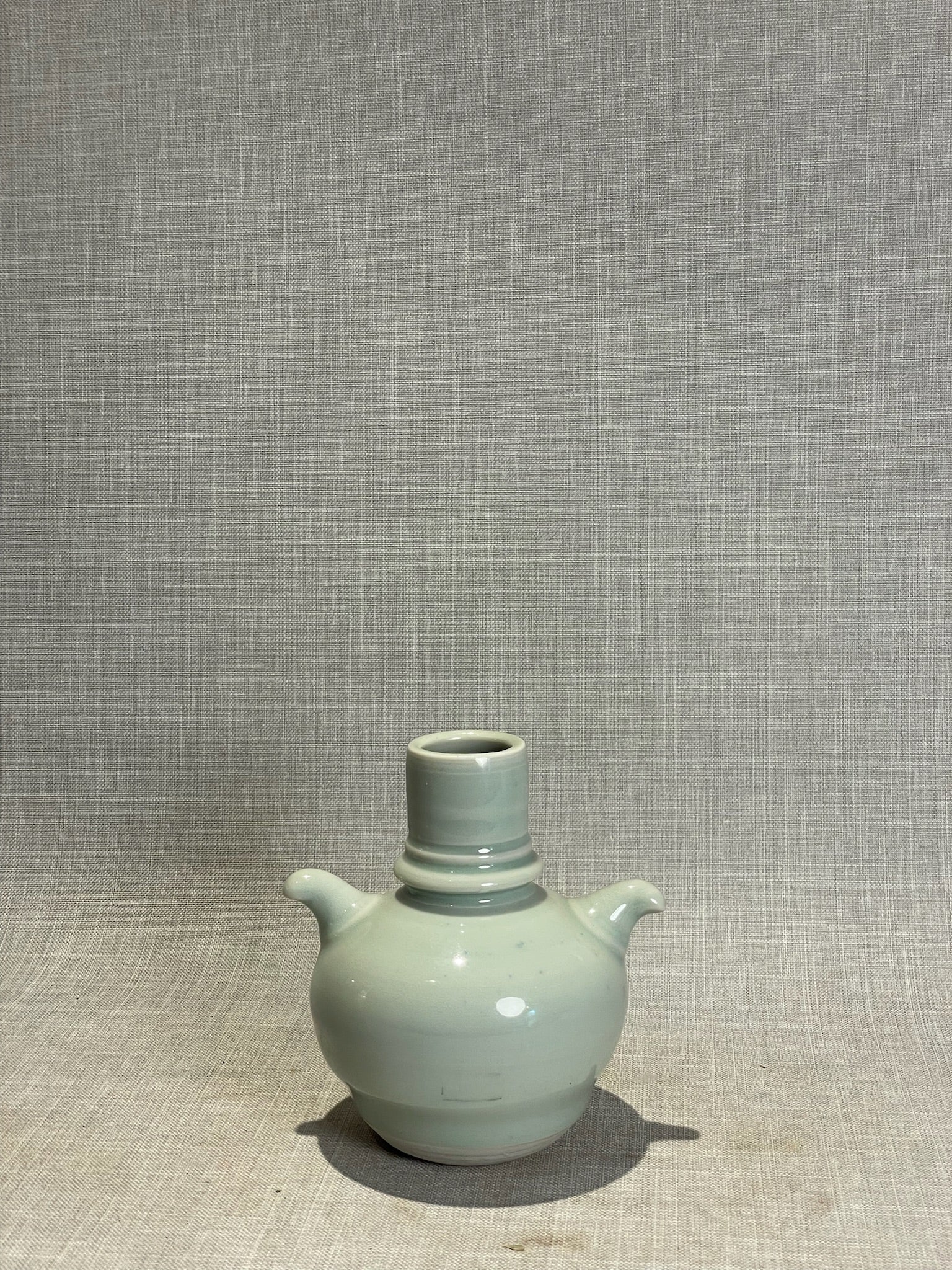 Elegant Pale Blue Studio Pottery Vase with Dual Sculpted Handles – Handcrafted Ceramic Art