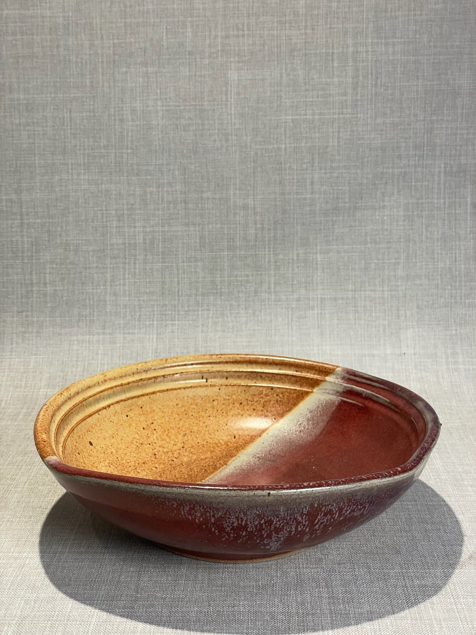 Large Two-Tone Studio Pottery Serving Bowl with Red Glaze & Natural Speckled Stoneware