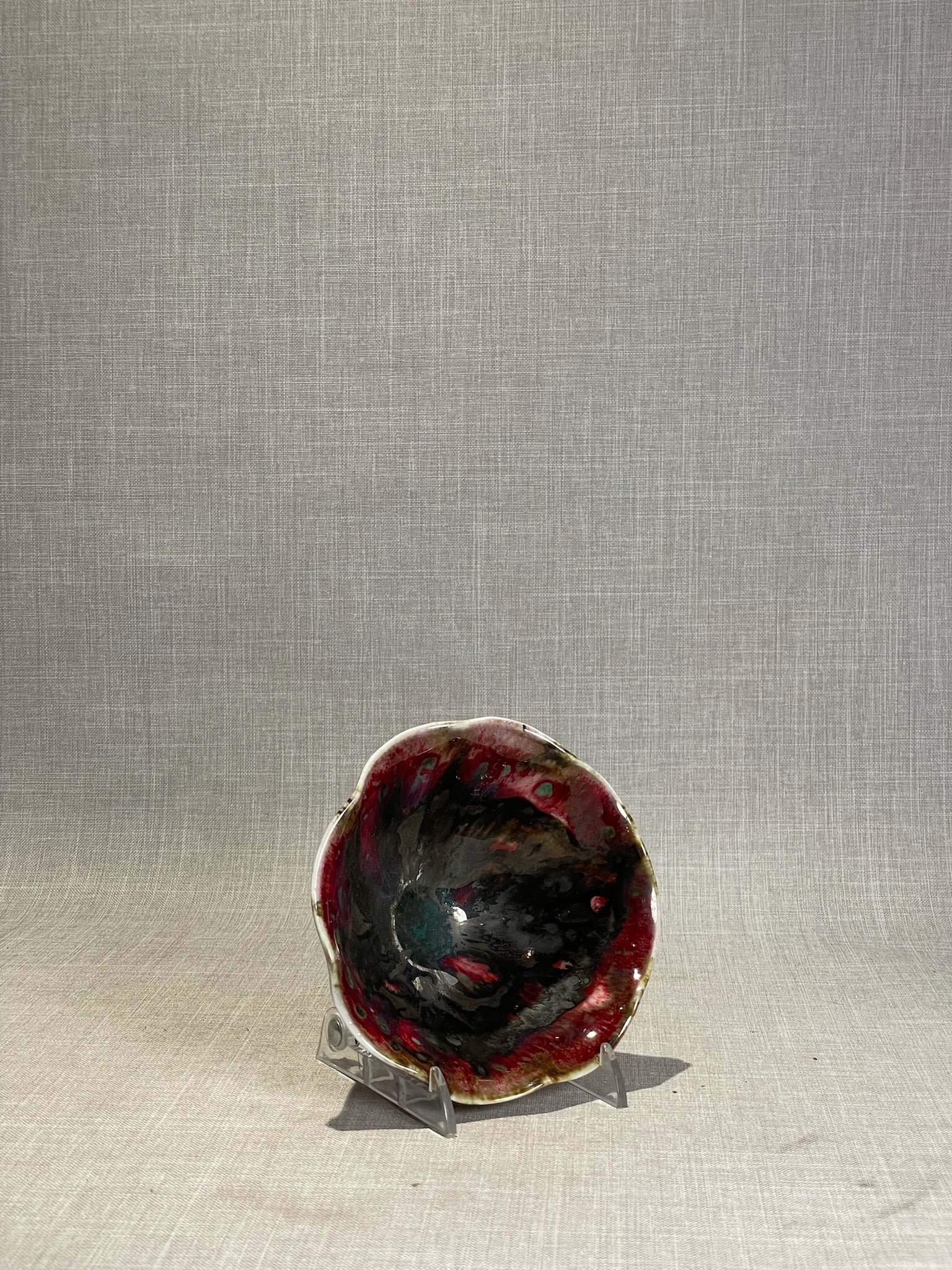 Artisan Handmade Fluted Ceramic Bowl with Dramatic Red, Black & Gold Reactive Glaze