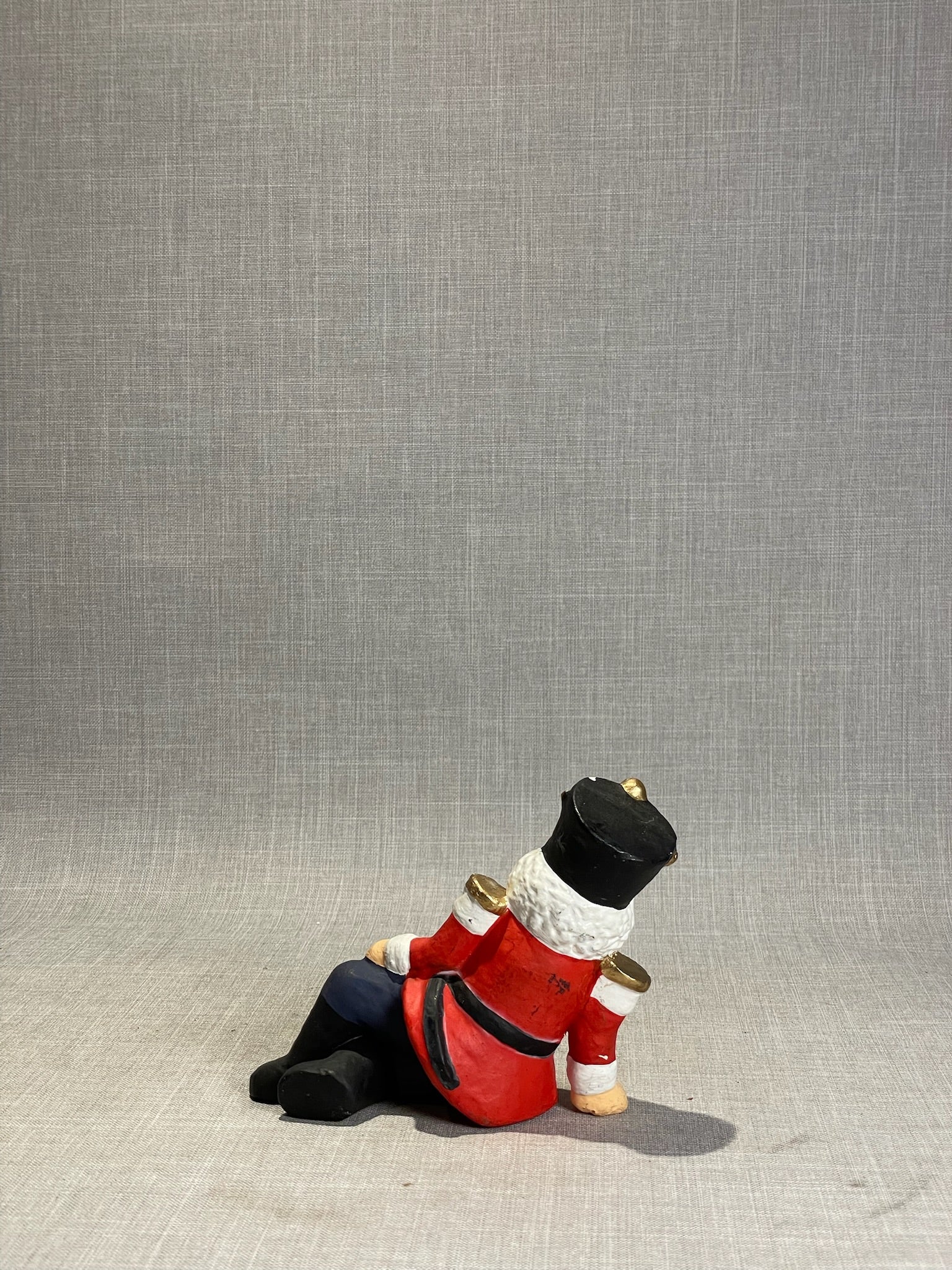 Whimsical Hand-Painted Reclining Nutcracker Soldier Holiday Figurine
