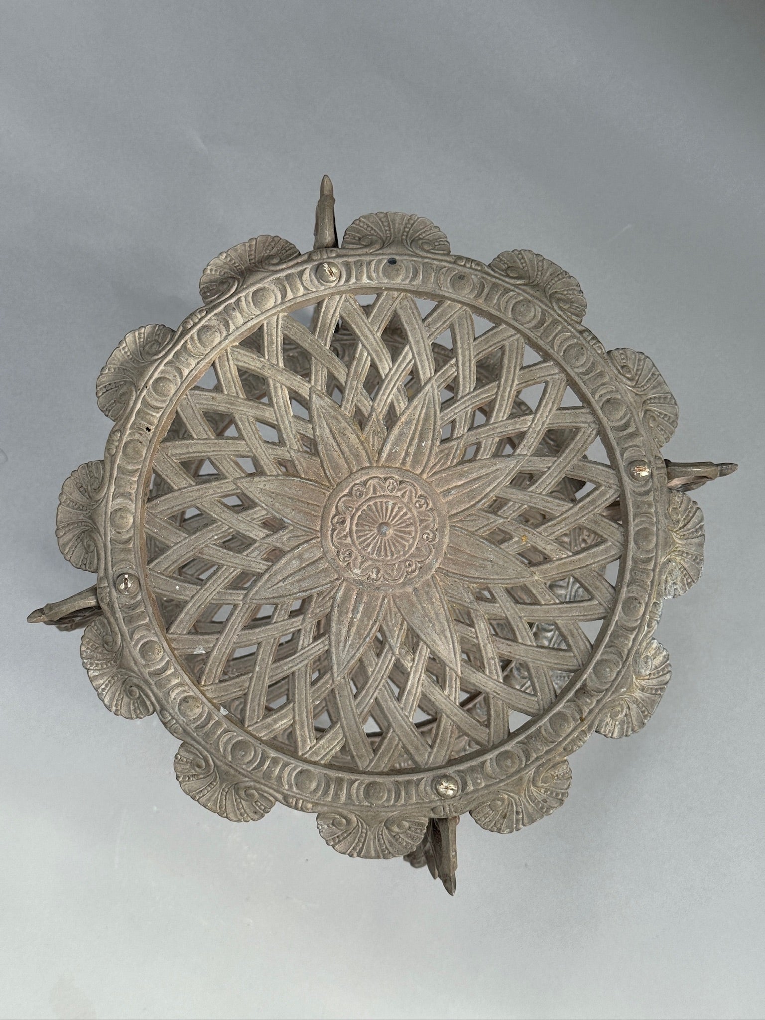 Ornate Victorian Revival Cast Iron Two-Tier Plant Stand with Pierced Floral Design top view showcasing intricate detailing. hommes + gardens estudio