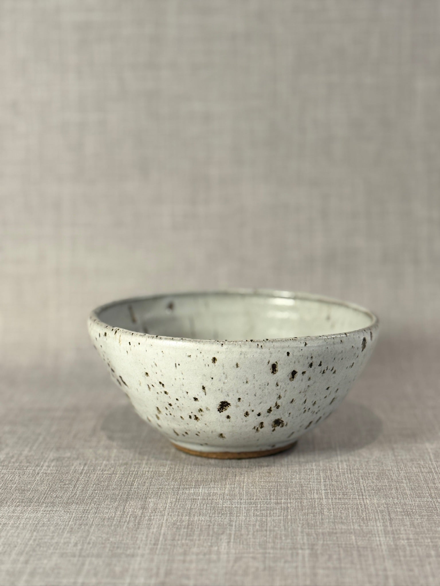 Signed Studio Art Pottery Stoneware Bowl with White Drip Glaze and Speckled Surface