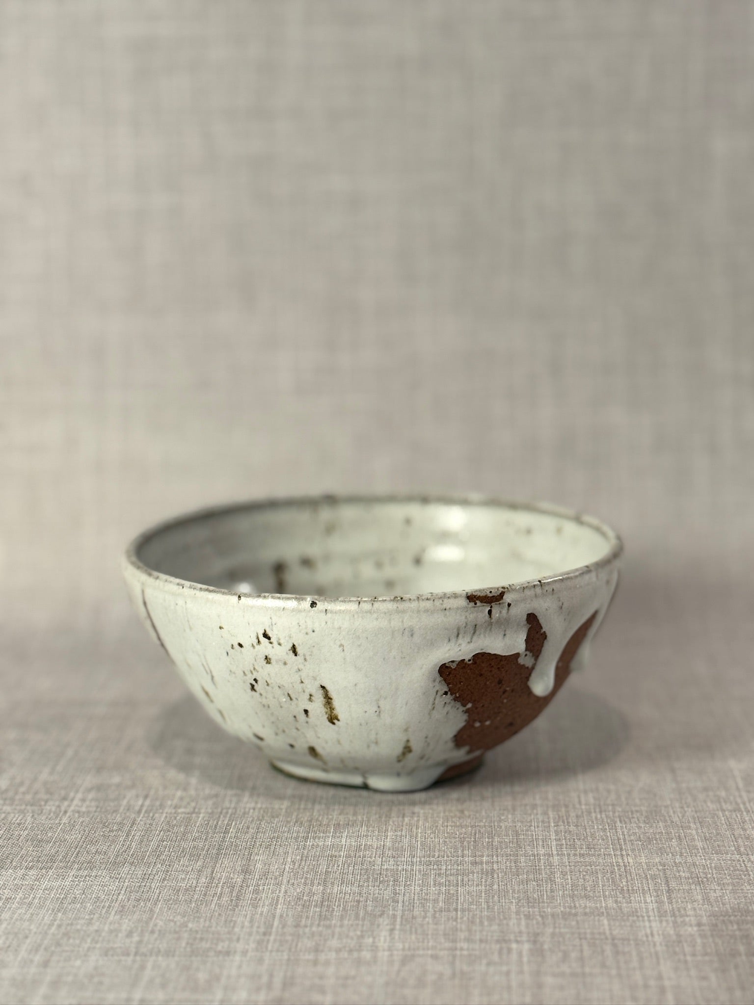 Signed Studio Art Pottery Stoneware Bowl with White Drip Glaze and Speckled Surface