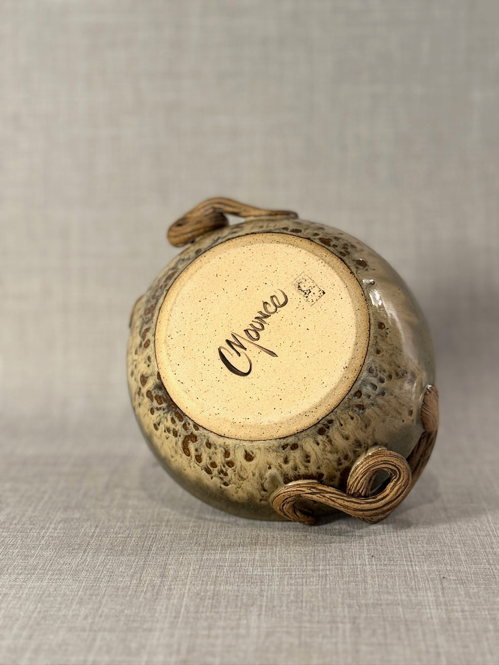 decorative stoneware bowl with olive green and beige glaze