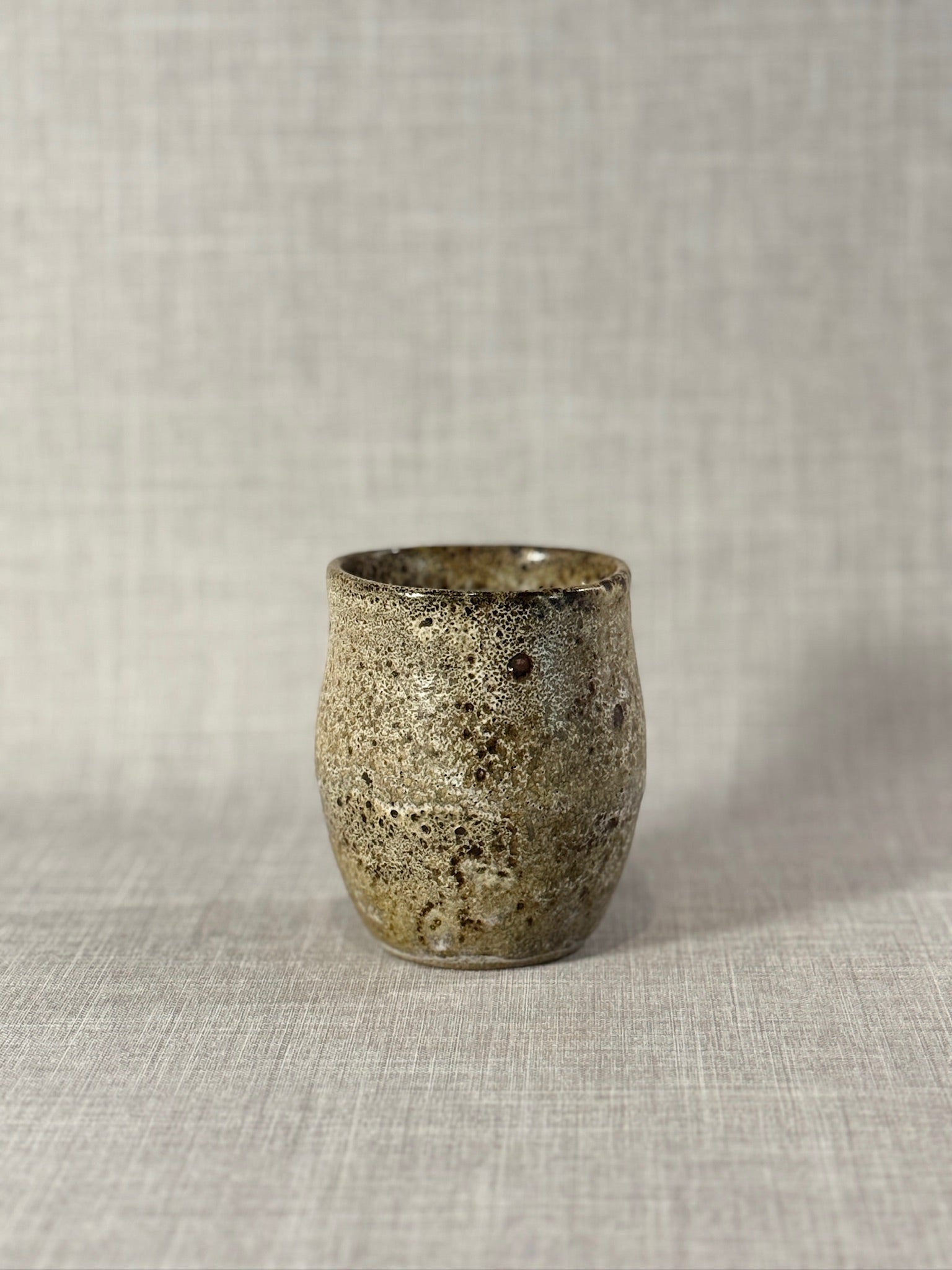 Handcrafted Studio Stoneware Cup with Speckled Ash Glaze and Organic Wabi-Sabi Form