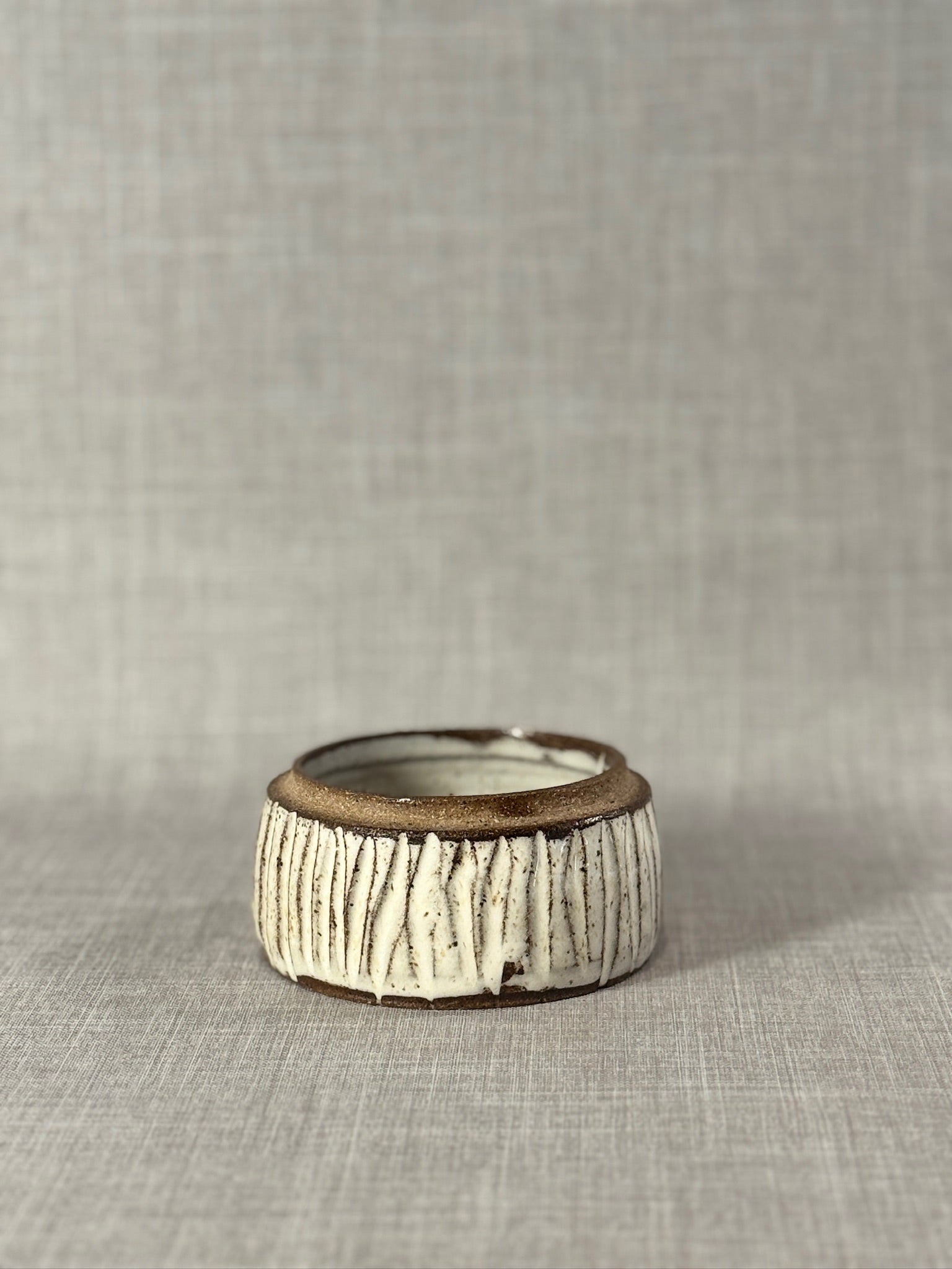 Textured Studio Pottery Bowl with Cream Glaze and Exposed Stoneware Rim