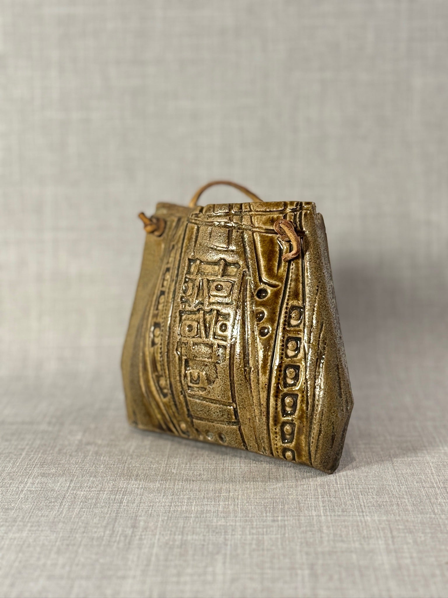 Decorative Ceramic Handbag Wall Sculpture with Leather Strap in rich glaze showcasing artisan craftsmanship - hommes + gardens estudio.