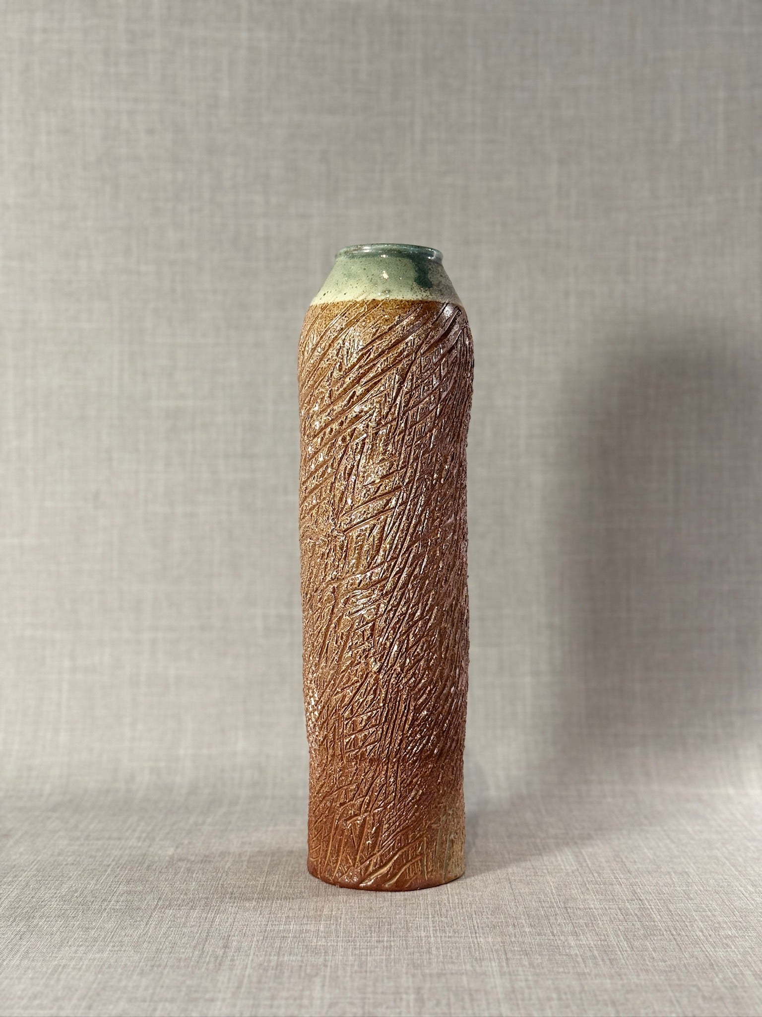 Tall Textured Studio Pottery Vase with Glazed Rim – Signed Ceramic Art Piece showcasing raw texture and elegant glazing details. hommes + gardens estudio.