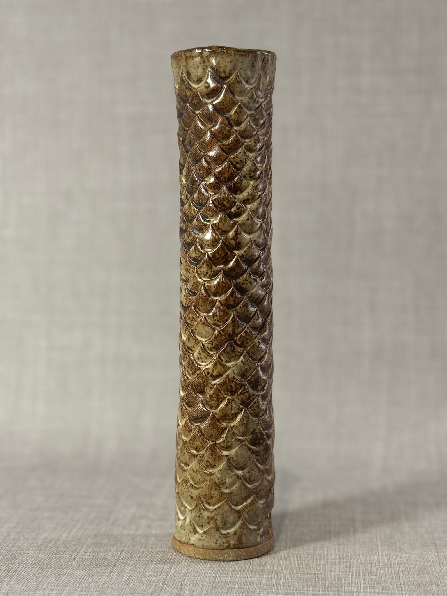 Tall Hand-Glazed Studio Pottery Vase with Fish Scale Relief showcasing a textured ceramic design in earthy glaze tones. hommes + gardens estudio
