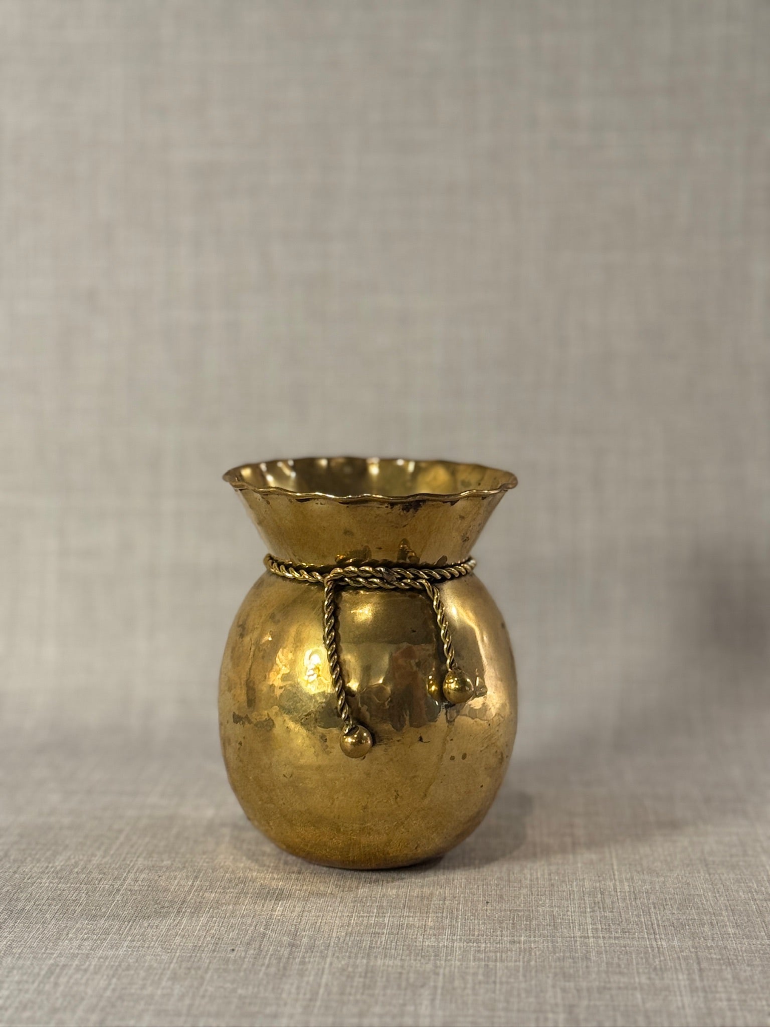 Elegant Early 20th Century Hand-Hammered Brass Vase with Twisted Rope and Scalloped Rim