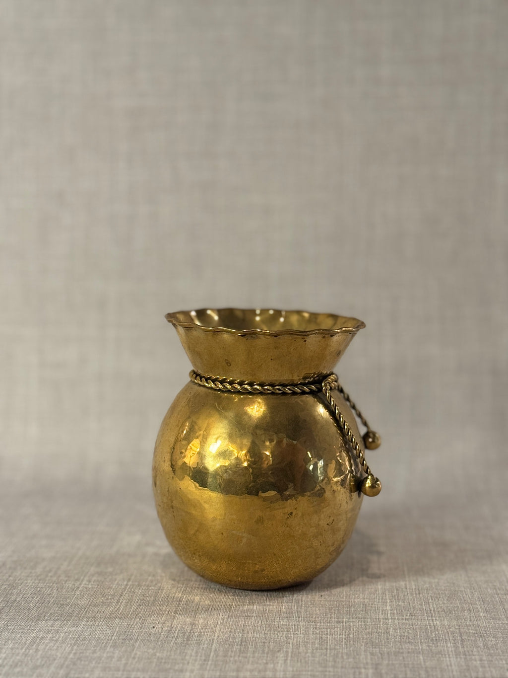 Elegant Early 20th Century Hand-Hammered Brass Vase with Twisted Rope and Scalloped Rim