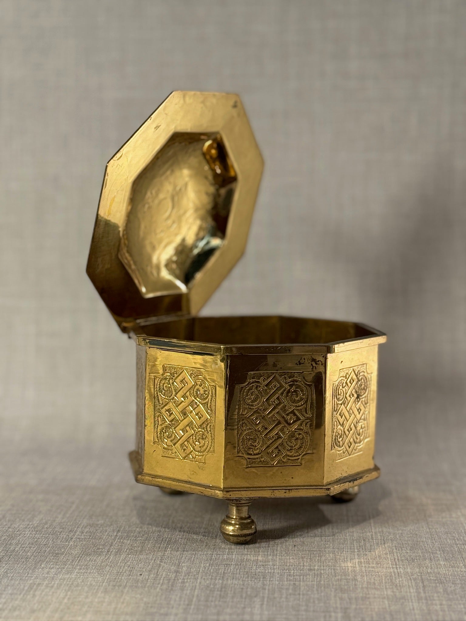 Early Middle-Eastern 20th Century Brass Octagonal Casket Box with Endless Knot Engravings and Finial Lid, Marked “C.P.”