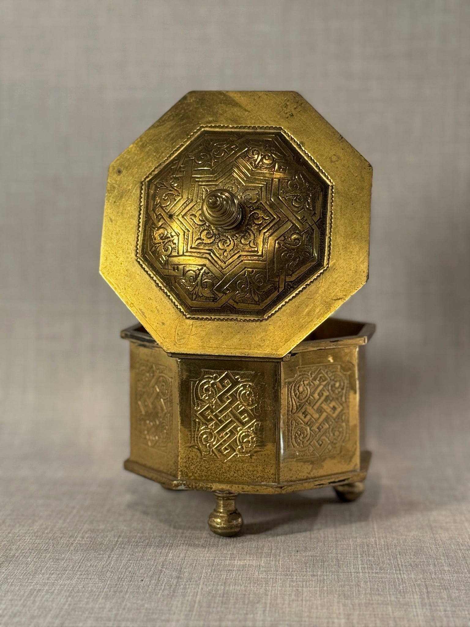 Early Middle-Eastern 20th Century Brass Octagonal Casket Box with Endless Knot Engravings and Finial Lid, Marked “C.P.”