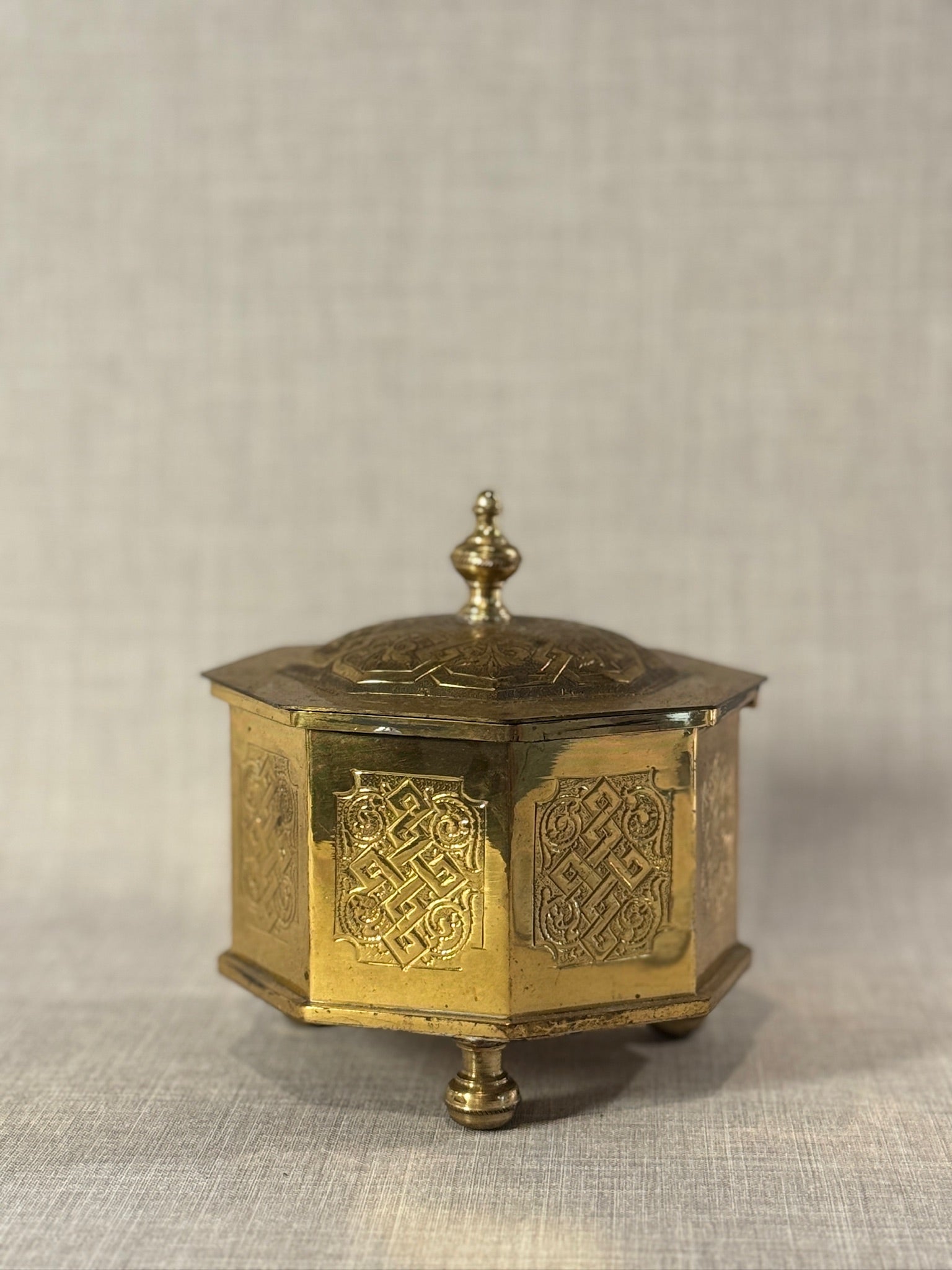 Early Middle-Eastern 20th Century Brass Octagonal Casket Box with Endless Knot Engravings and Finial Lid, Marked “C.P.”
