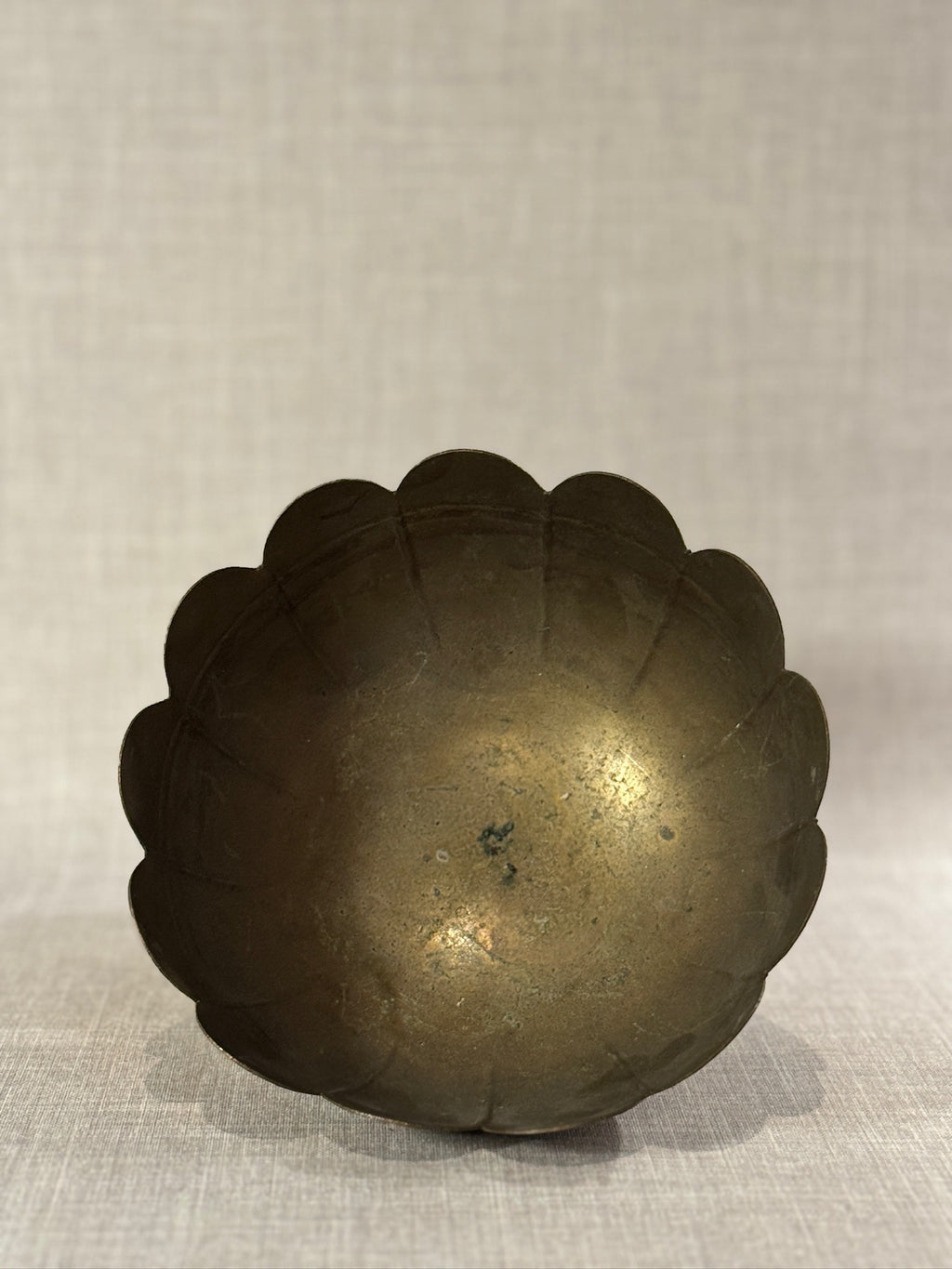 mid century brass bowl with scalloped rim and ornate base