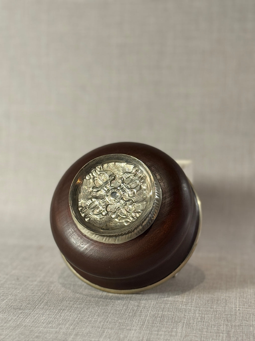 Himalayan ritual wooden bowl with embossed metal pedestal
