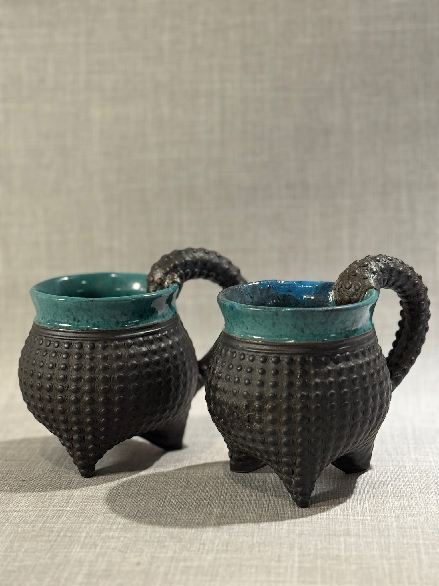 Artist-Signed Sandi Pierantozzi Ceramic Mugs – Textured Sea Urchin Design with Tentacle Handles (Set of 2)