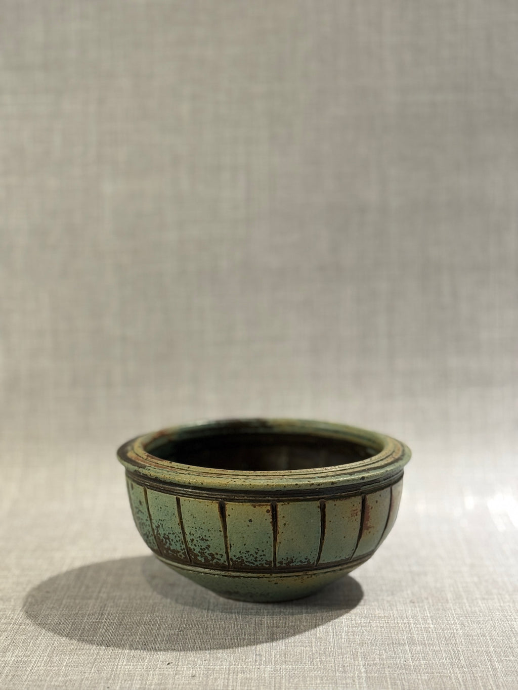artisan green glazed ceramic bowl with rustic finish
