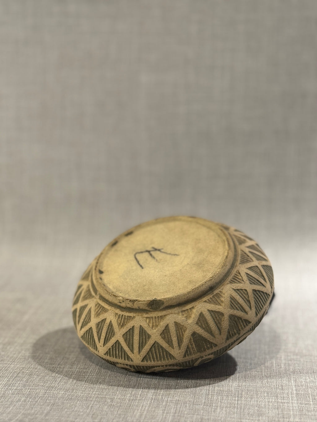 handmade vintage pottery bowl with carved patterns