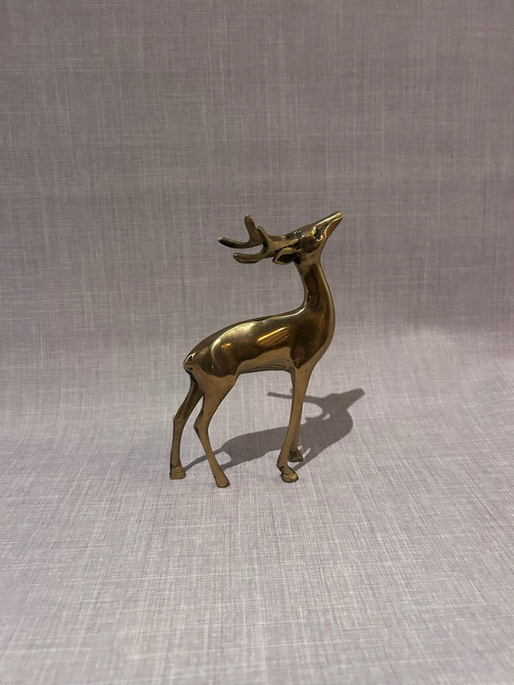 Exceptional Mid-Century Modern Solid Brass Deer Sculptures, Elegant Buck and Grazing Doe Figurines, Refined Modernist Animal Forms